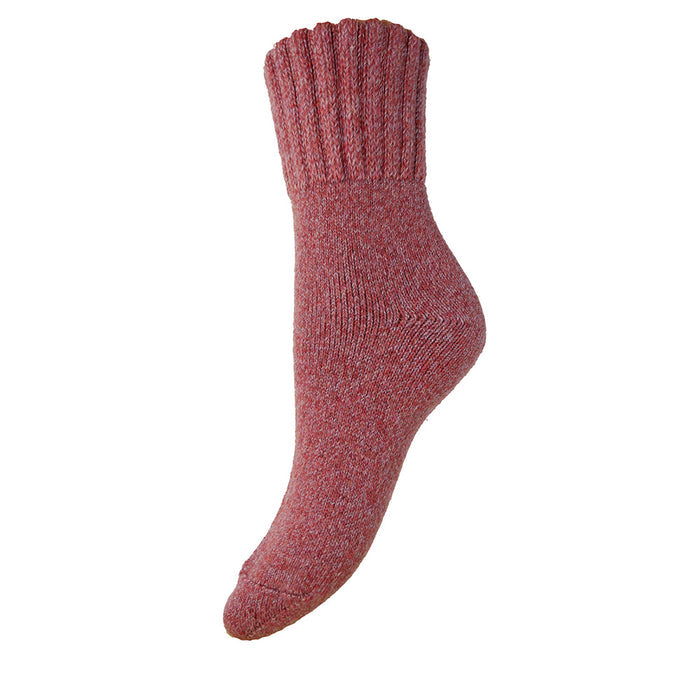 A marled red wool blend sock with a ribbed cuff, laid flat on a plain background.