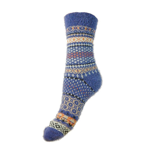 A blue wool sock with Scandi geometric patterns in fawn and rust colors