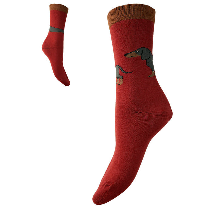 A pair of red bamboo socks with a long Dachshund dog design and contrasting tan cuff.