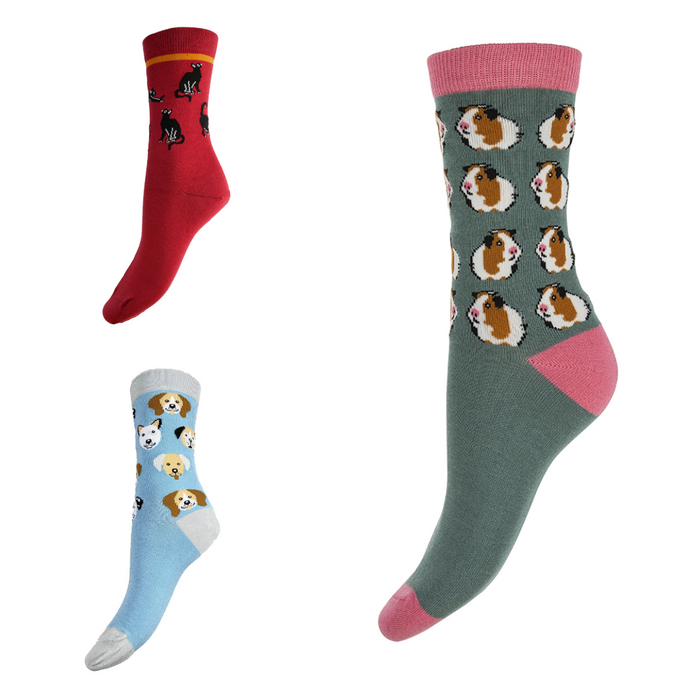Three bamboo socks with dogs, cats and guinea pigs motifs on a white background