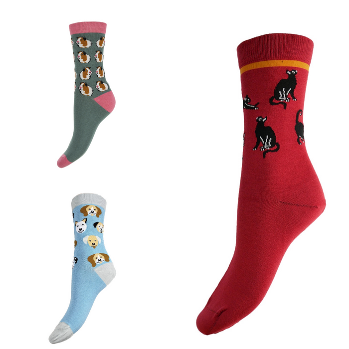 Three socks with animal patterns (dogs, cats and guinea pigs) on a white background