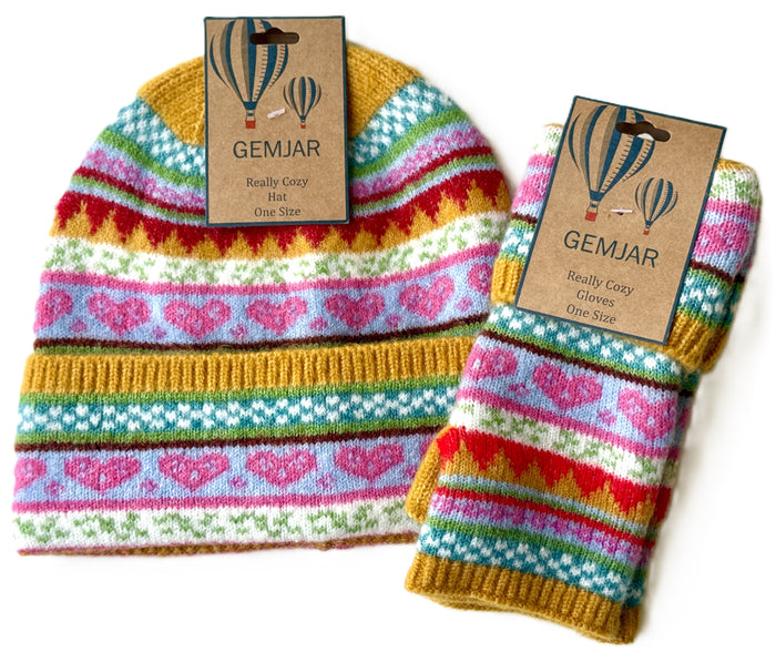 A knitted beanie and matching glove set with colorful Fair Isle stripes in pink, blue, green, yellow, and red, each with a brown paper hangtag reading GEMJAR.