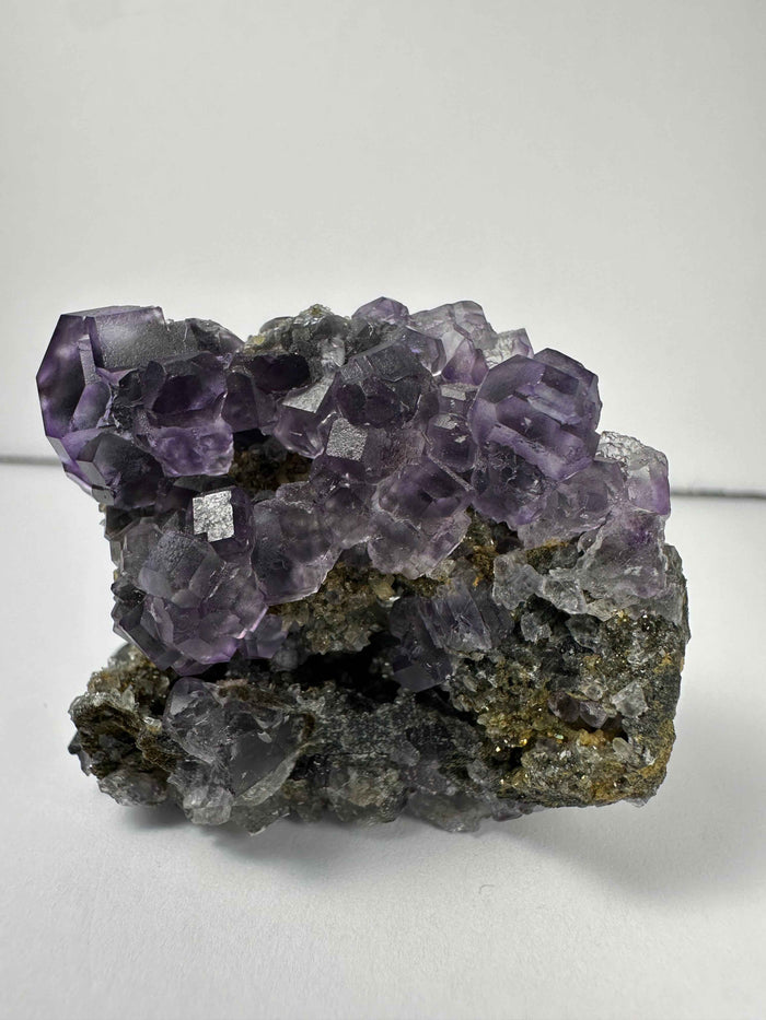 Purple Dodecahedral Fluorite with Calcite on matrix - Smokin Resin Company