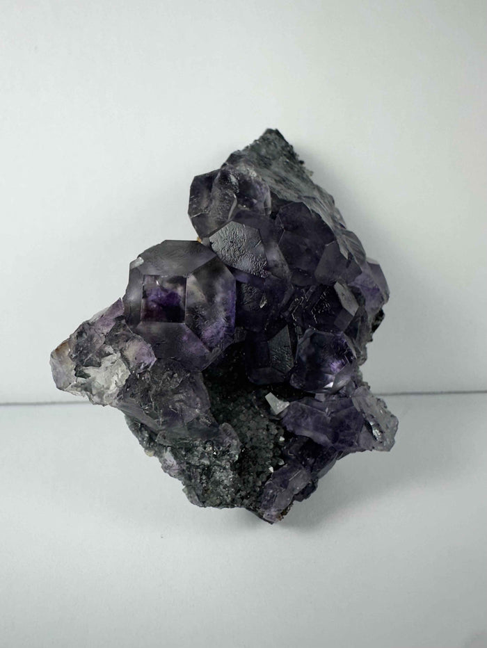 Purple Dodecahedral Fluorite with Calcite on matrix - Smokin Resin Company