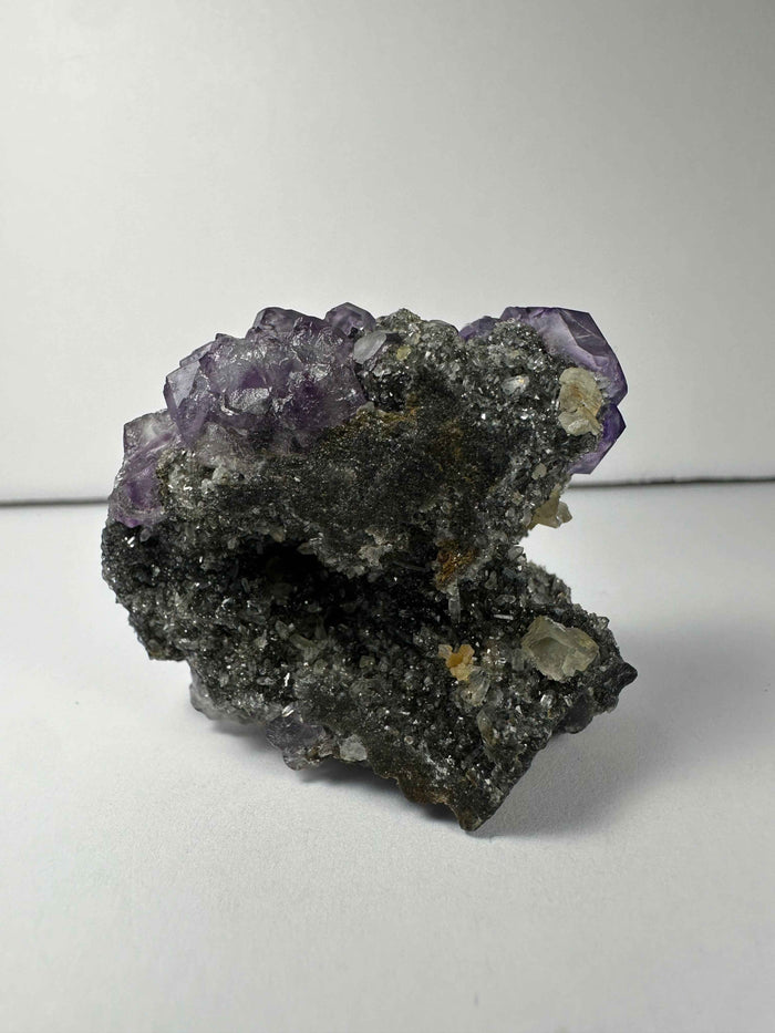 Purple Dodecahedral Fluorite with Calcite on matrix - Smokin Resin Company