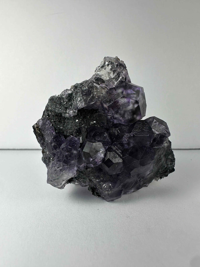 Purple Dodecahedral Fluorite with Calcite on matrix - Smokin Resin Company