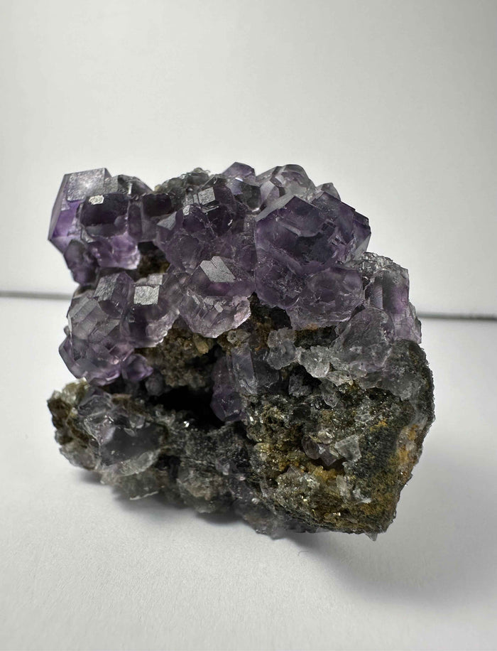 Purple Dodecahedral Fluorite with Calcite on matrix - Smokin Resin Company