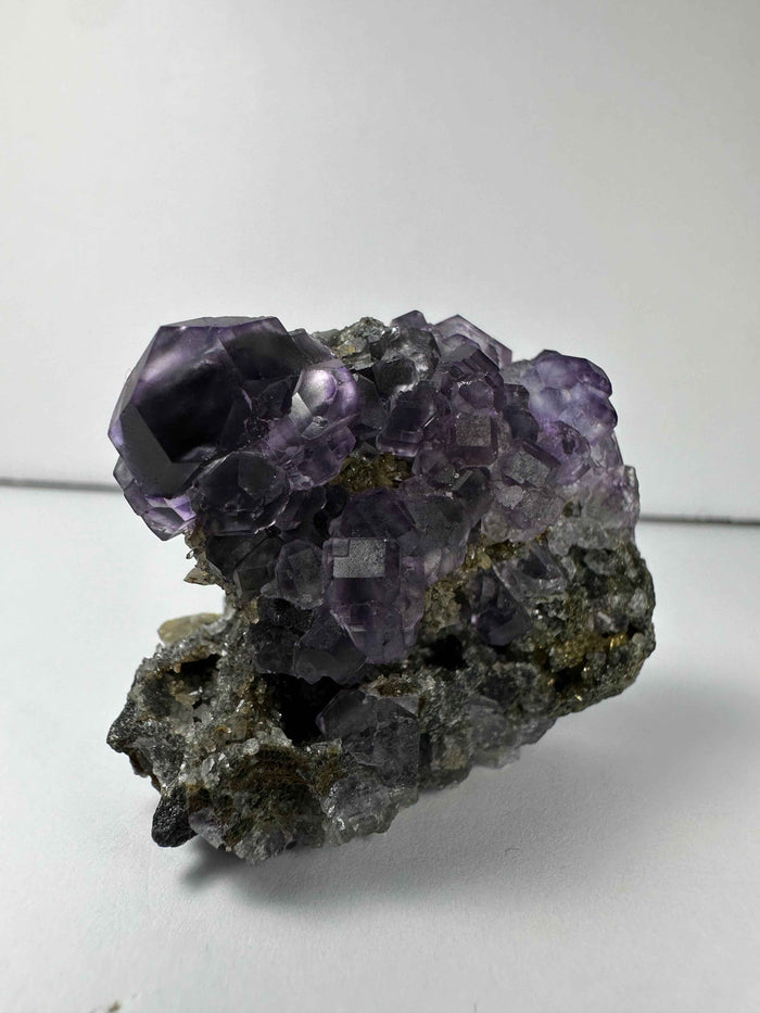 Purple Dodecahedral Fluorite with Calcite on matrix - Smokin Resin Company