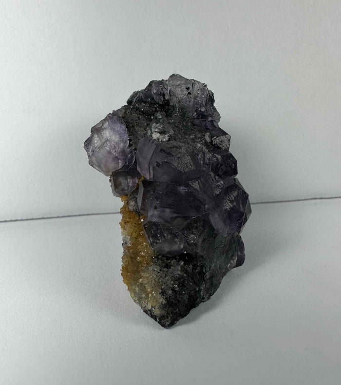 Purple Dodecahedral Fluorite with Calcite on matrix - Smokin Resin Company